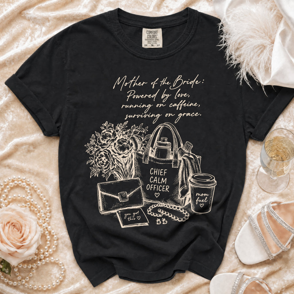 Black t-shirt with "Mother of the Bride" graphic featuring flowers, purse, and coffee cup.