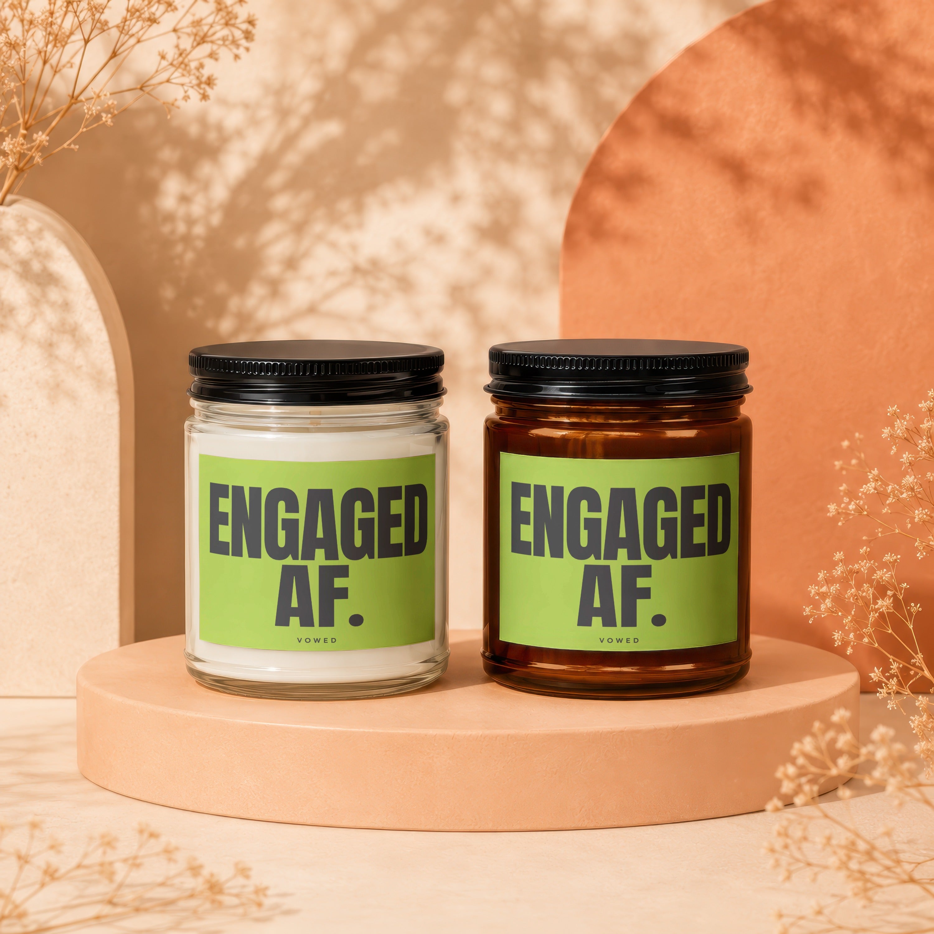 Two candles with "ENGAGED AF." text on lime green labels.
