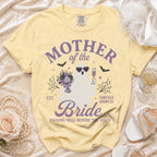 Yellow t-shirt with "Mother of the Bride Forever Haunted" text and ghost graphic.