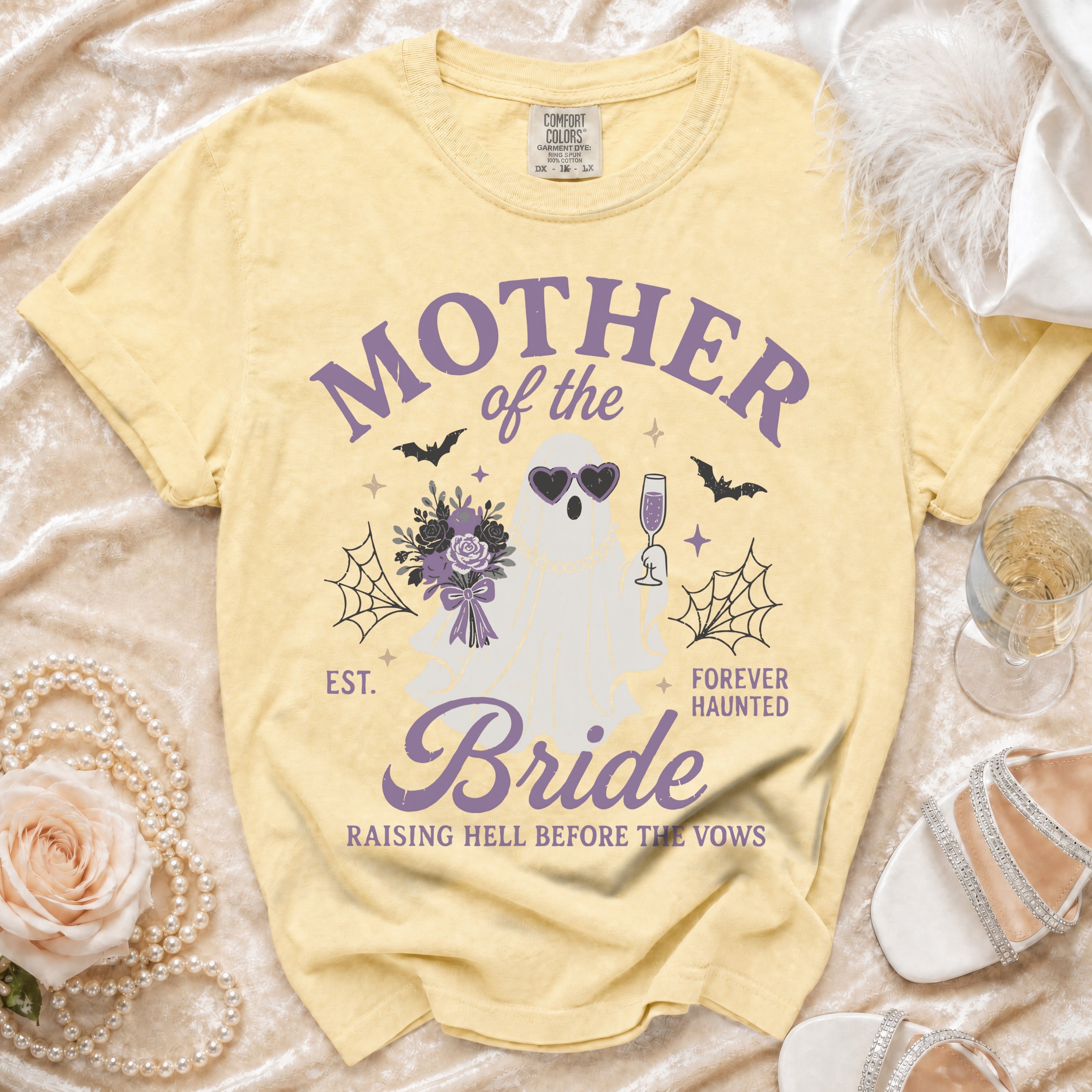 Yellow t-shirt with "Mother of the Bride Forever Haunted" text and ghost graphic.