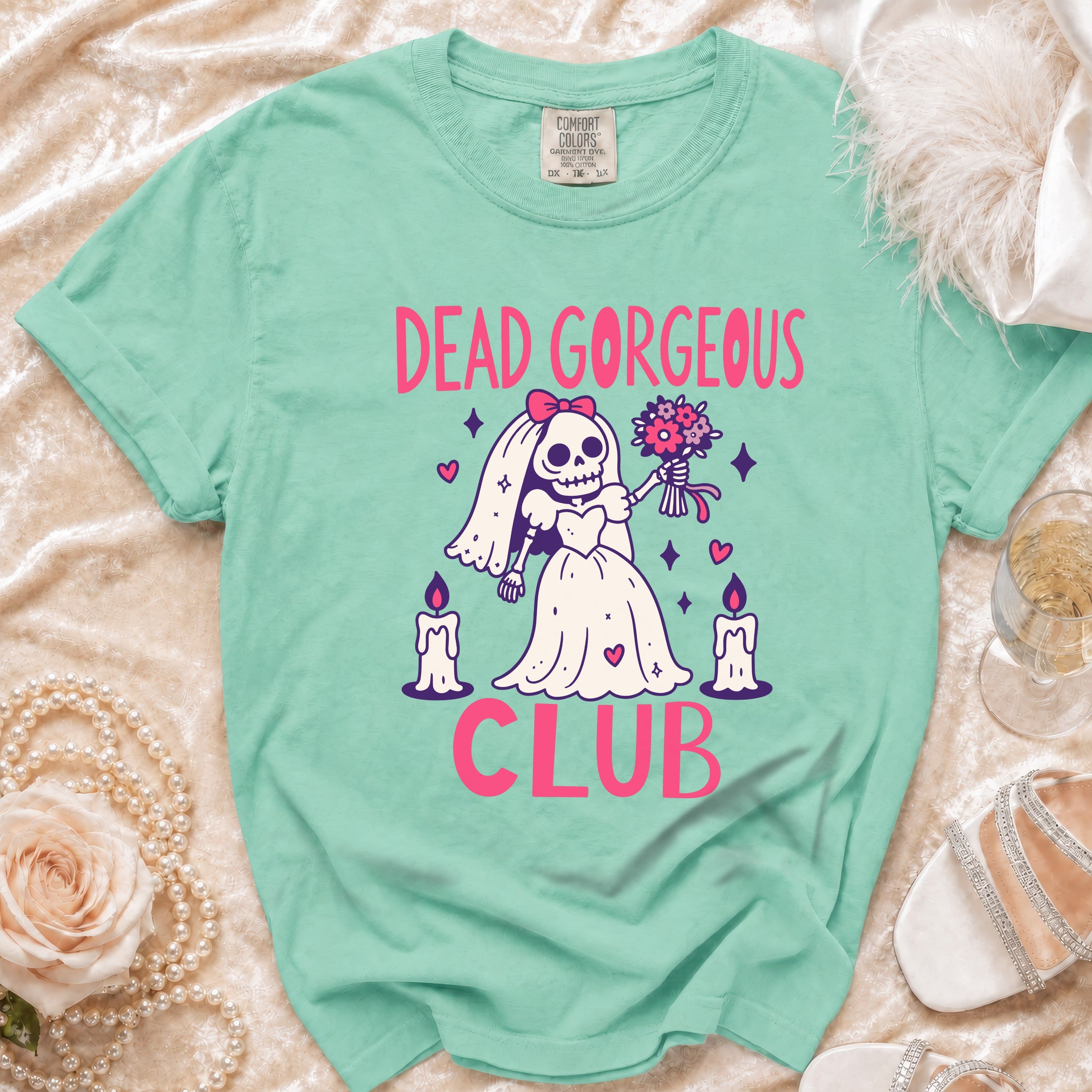 Mint green t-shirt with skull bride graphic and "DEAD GORGEOUS CLUB" text.