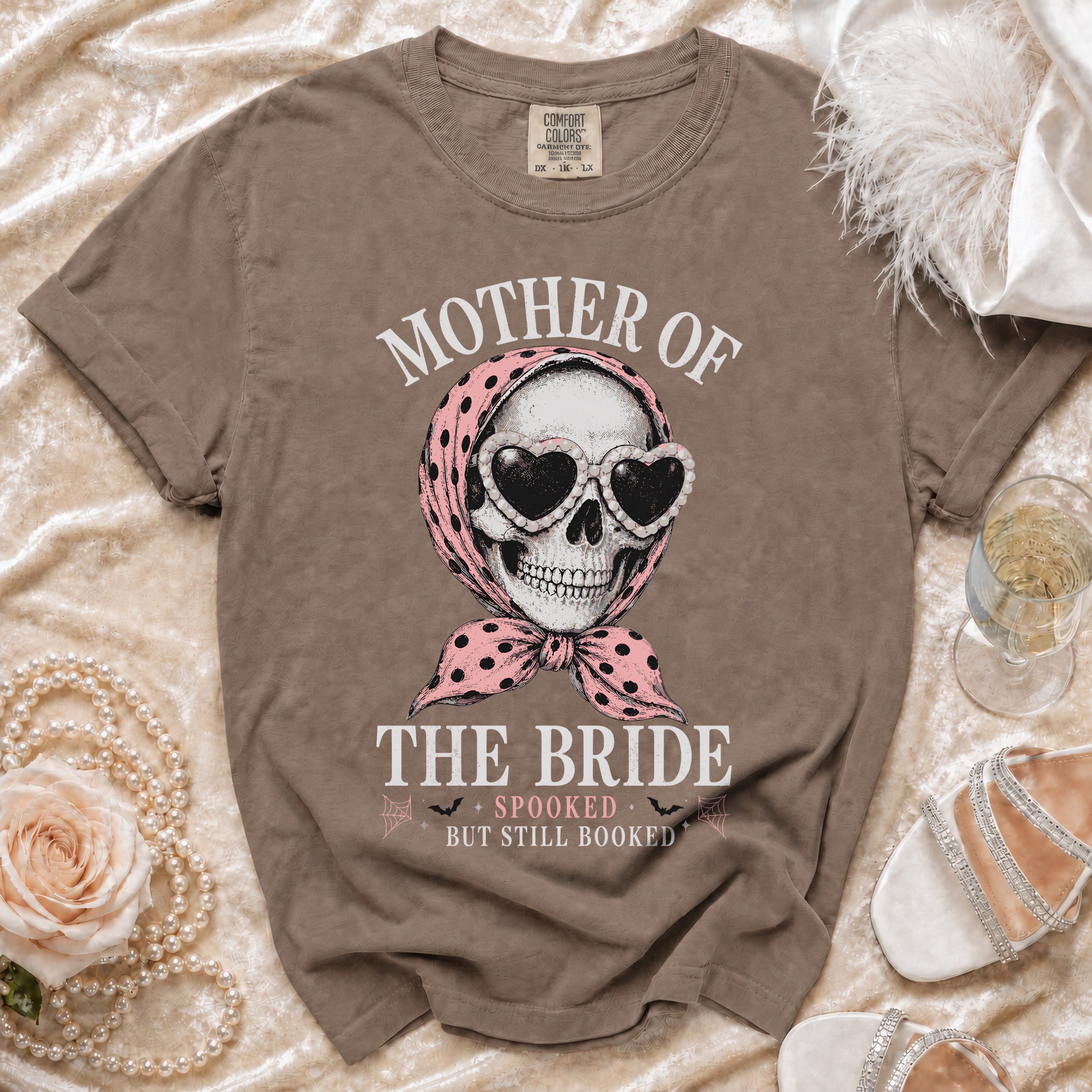T-shirt with skull wearing heart sunglasses and scarf, reading "Mother of the Bride, Spooked But Still Booked".