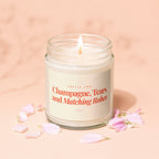 Candle with a lit wick, labeled "Champagne, Tears and Matching Robes."