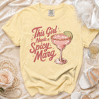 Yellow t-shirt with "This Girl Needs a Spicy Marg" text and margarita graphic.
