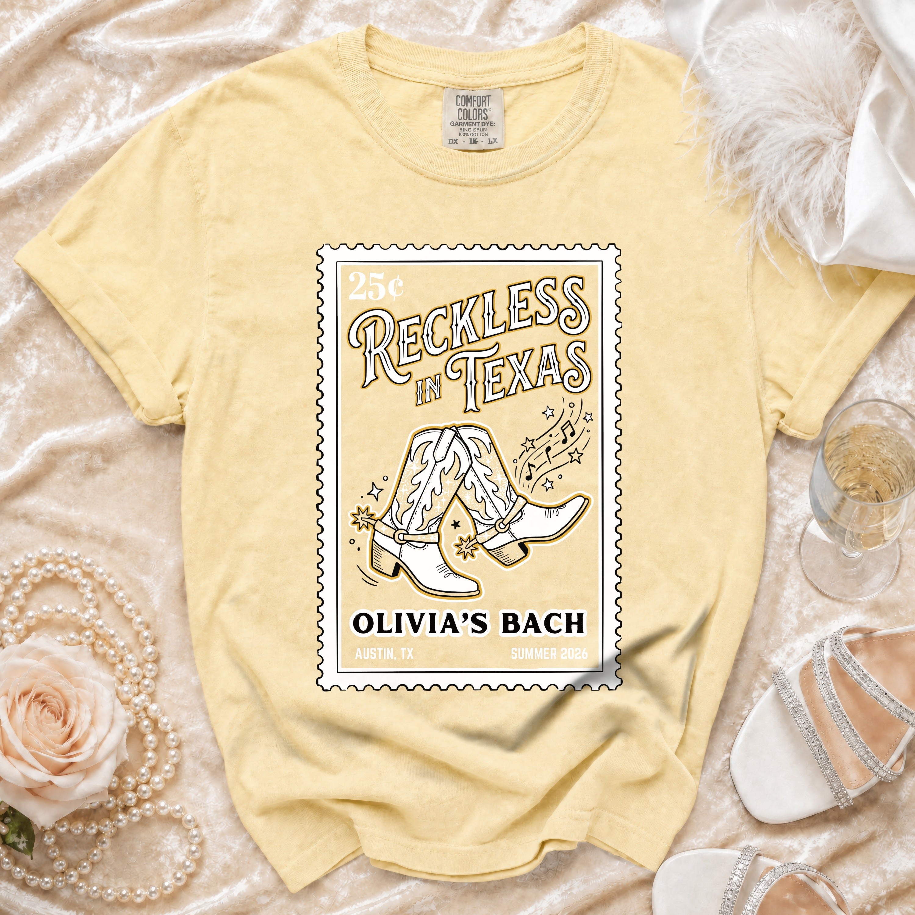 Yellow t-shirt with "Reckless in Texas" stamp design, boots, and event details.