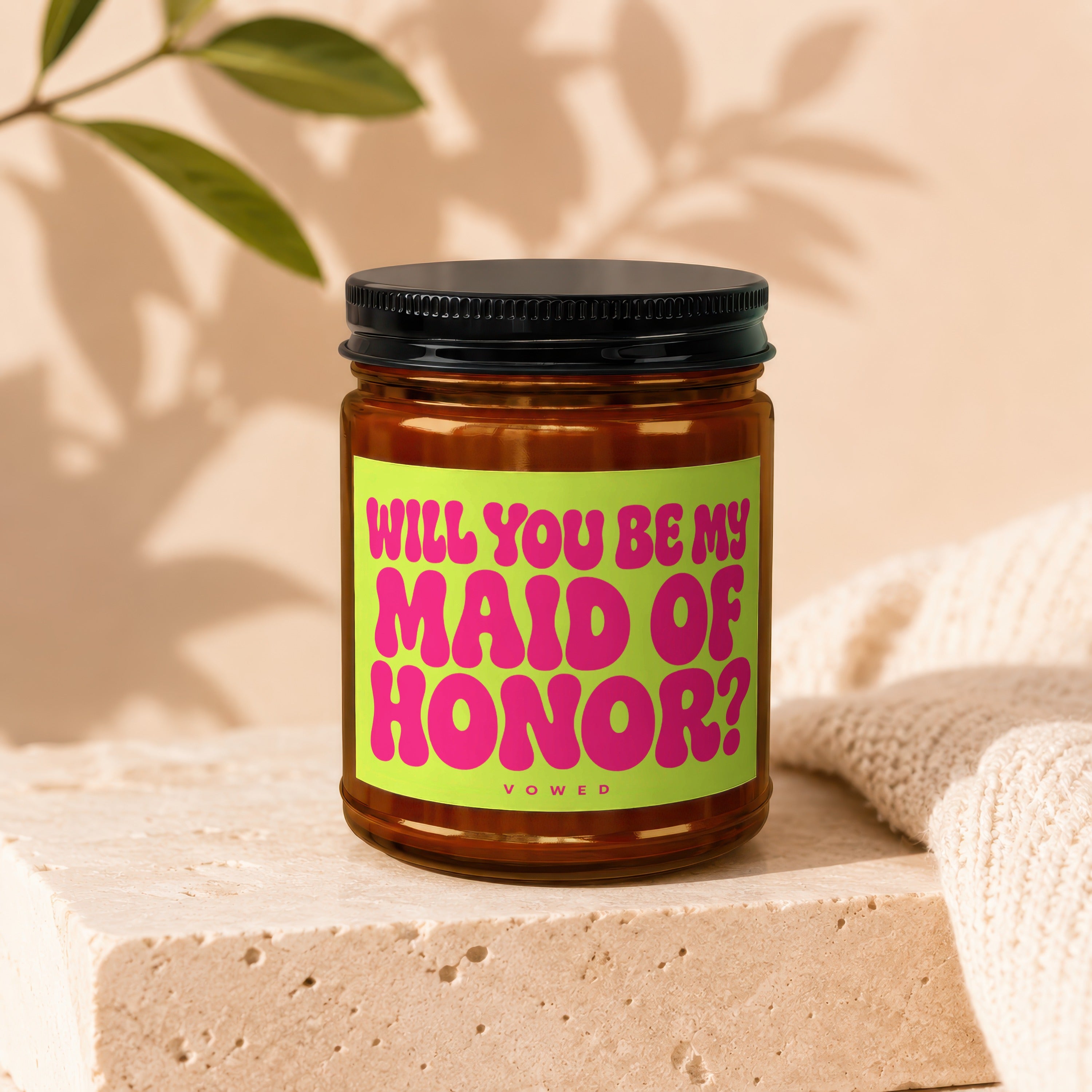 Candle with label that says "WILL YOU BE MY MAID OF HONOR?" and "VOWED".