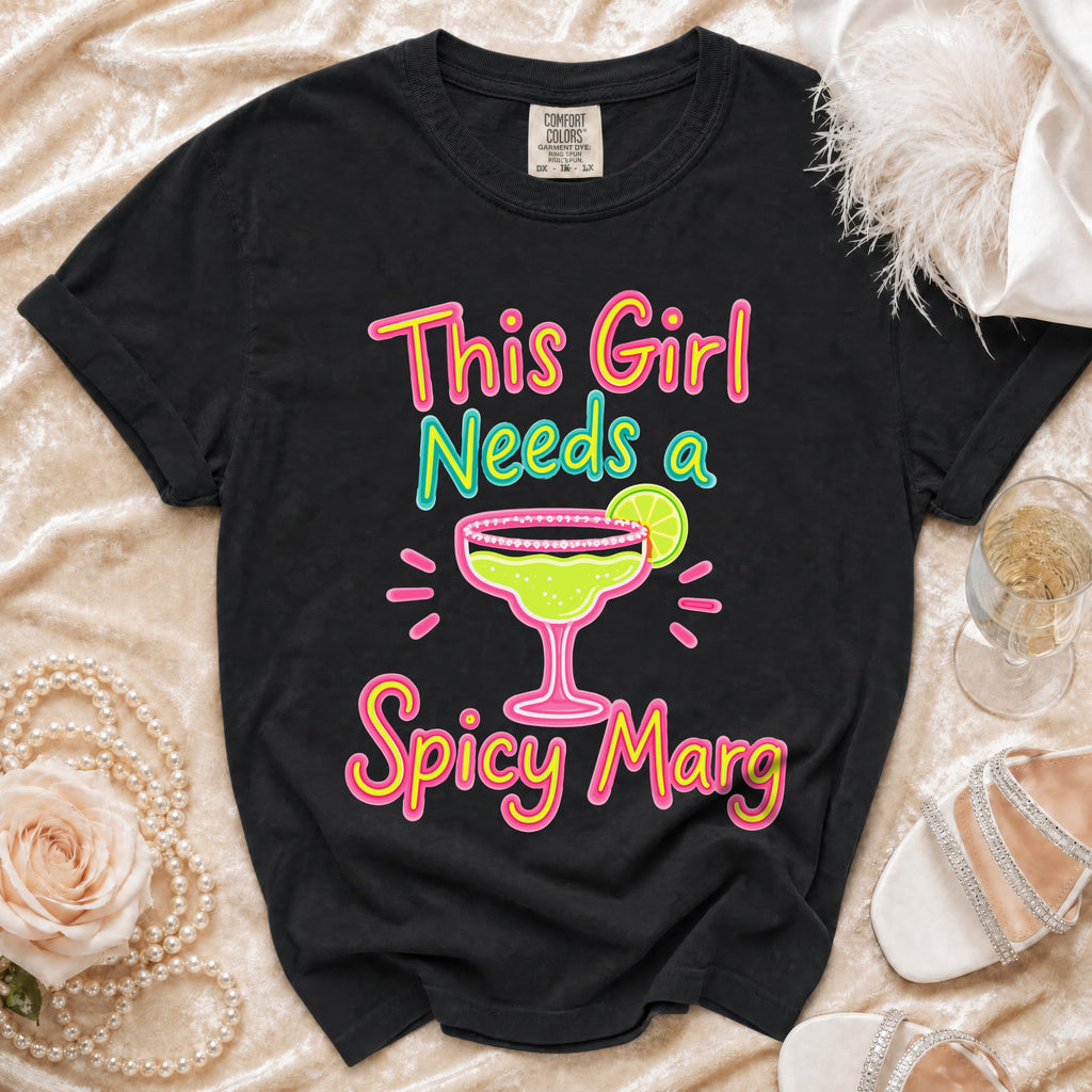 Black t-shirt with "This Girl Needs a Spicy Marg" text and margarita graphic.