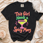 Black t-shirt with "This Girl Needs a Spicy Marg" text and margarita graphic.