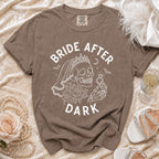 Brown t-shirt with white "BRIDE AFTER DARK" text and skull graphic.