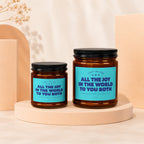 Two glass jars with black lids, labels read "Light Me For All The Joy In The World To You Both".