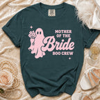 Dark teal t-shirt featuring a pink graphic of a ghost holding flowers, with the text Mother of the Bride Boo Crew.