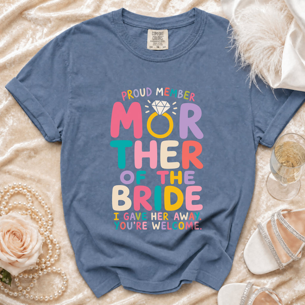 Blue t-shirt with "Proud Member Mother of the Bride" text and diamond ring.