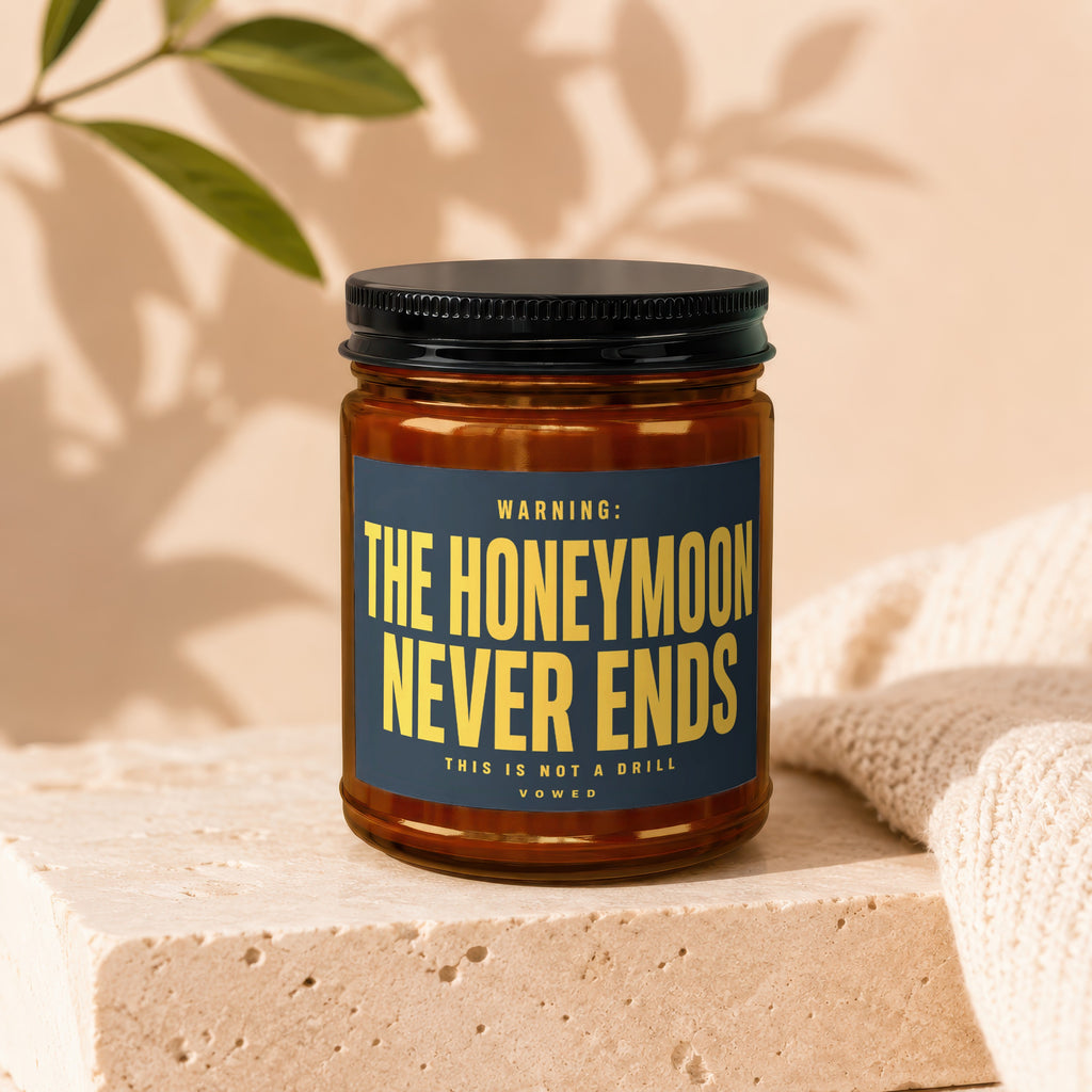 Candle with label "WARNING: THE HONEYMOON NEVER ENDS THIS IS NOT A DRILL VOWED".