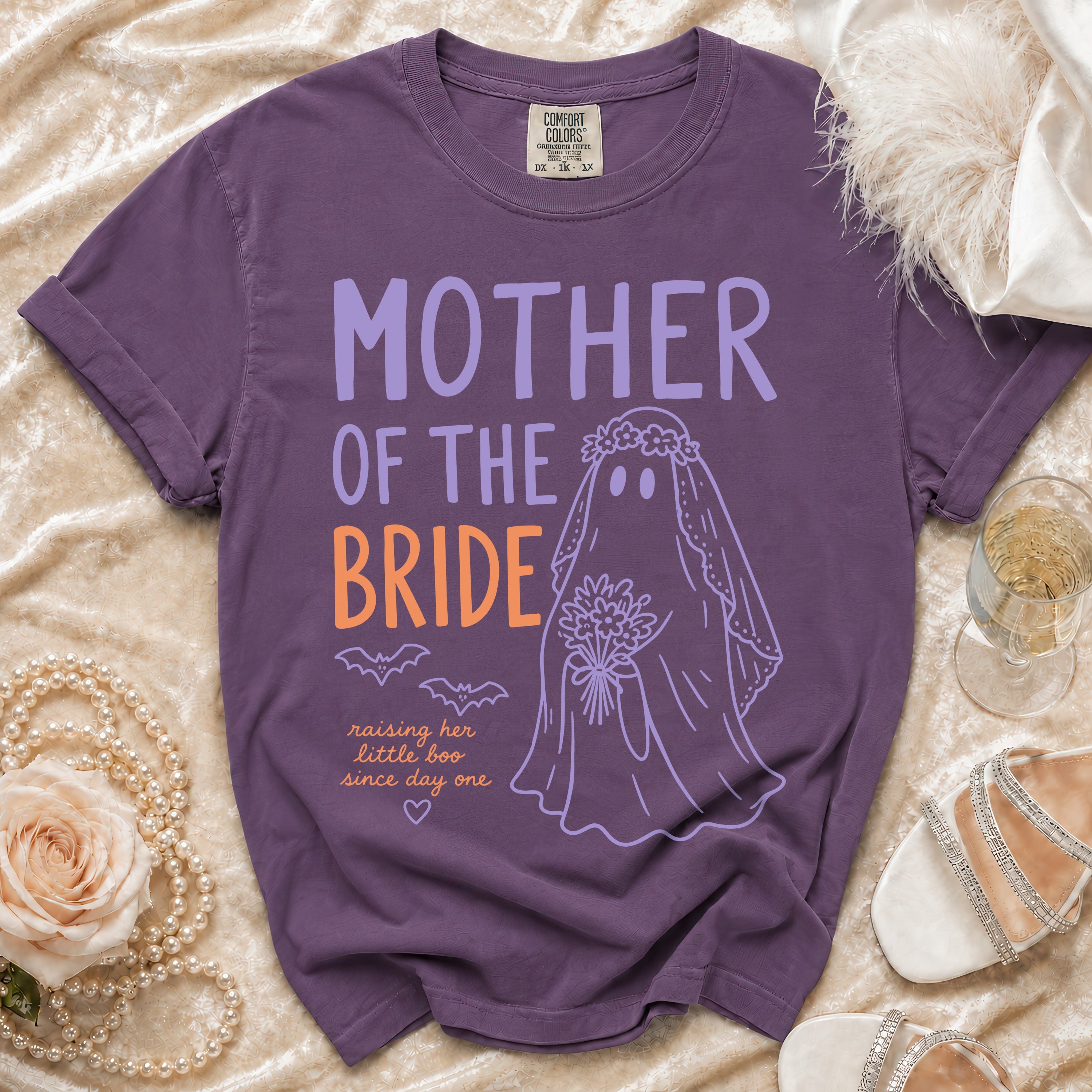 Purple t-shirt with "Mother of the Bride" text and ghost graphic.