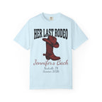 Light blue t-shirt with "Her Last Rodeo" and cowboy boot graphic.