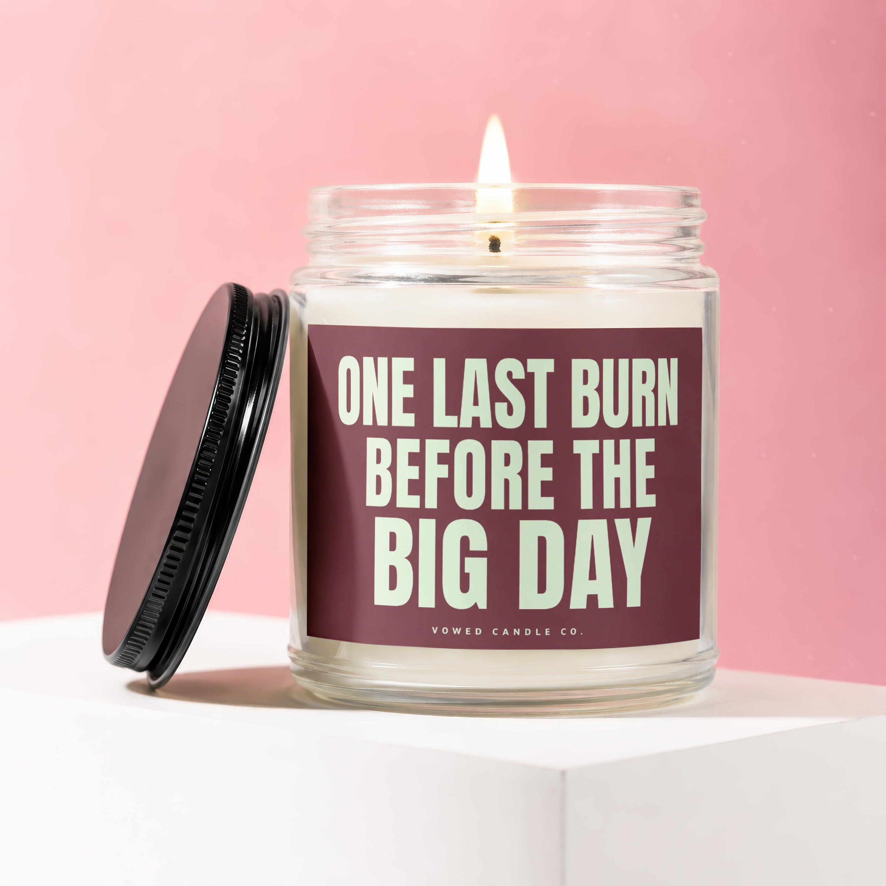 Soy candle with "One Last Burn Before the Big Day" text and a lit wick.