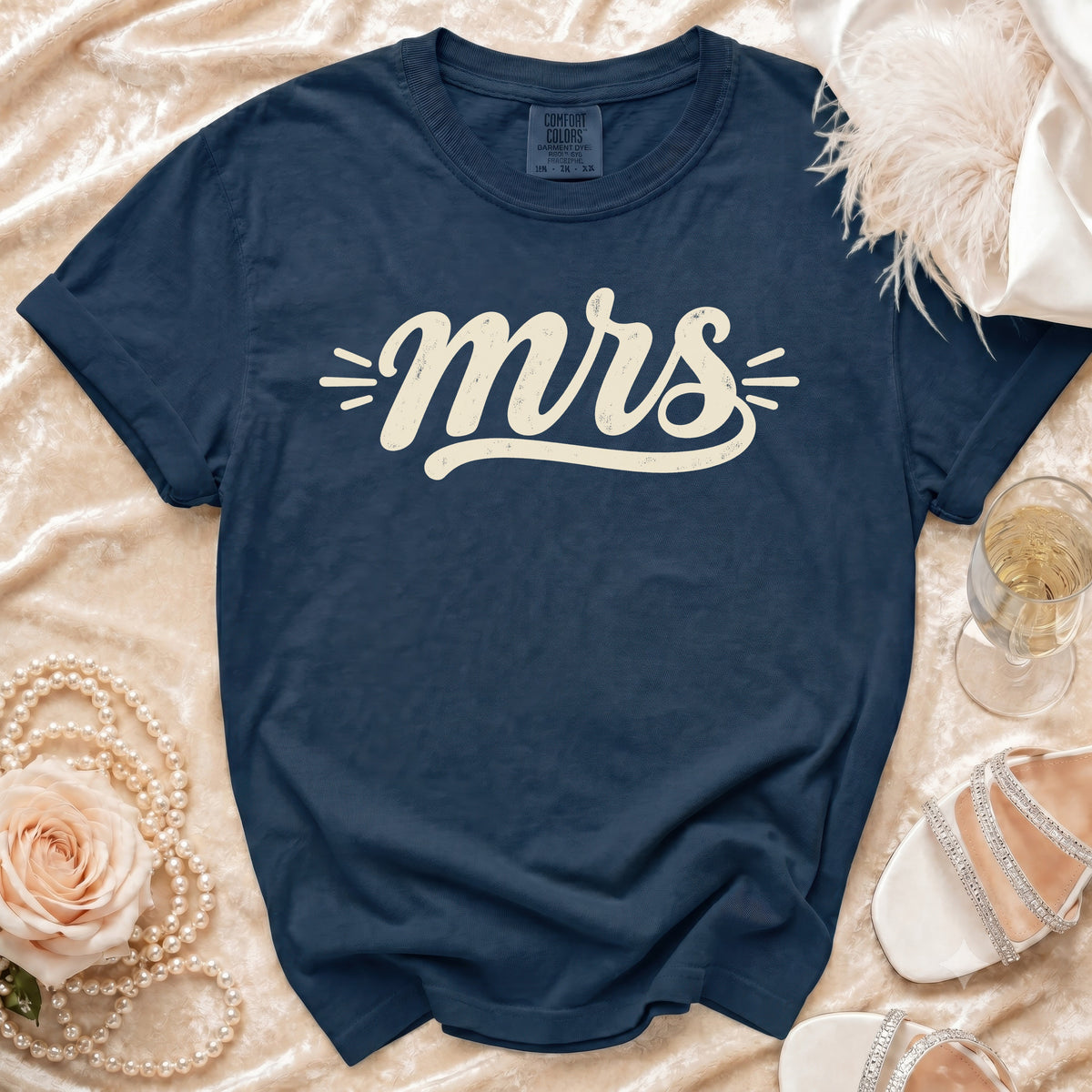Navy Comfort Colors t-shirt with cream "mrs" text, on satin.