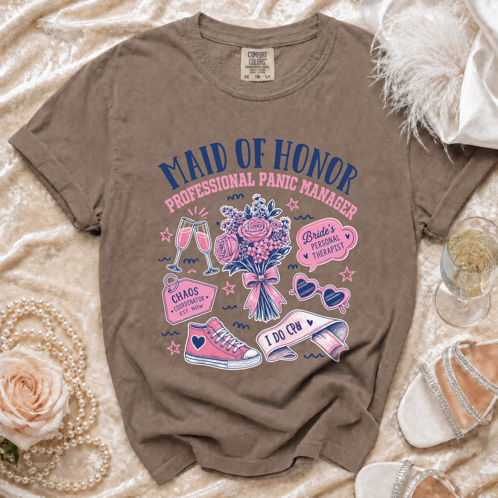 Brown t-shirt with "Maid of Honor Professional Panic Manager" graphic, flowers, and accessories.