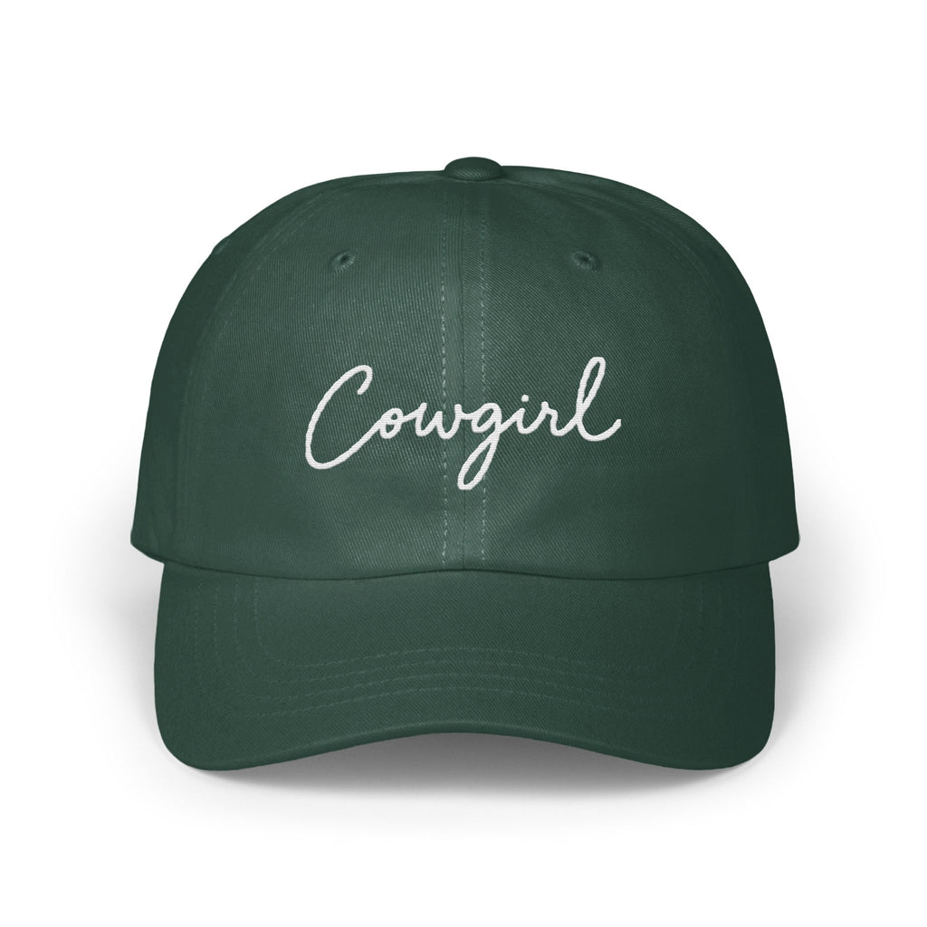 Dark green baseball cap with the word Cowgirl embroidered in white script across the front.