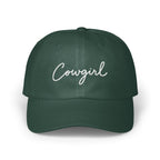 Dark green baseball cap with the word Cowgirl embroidered in white script across the front.