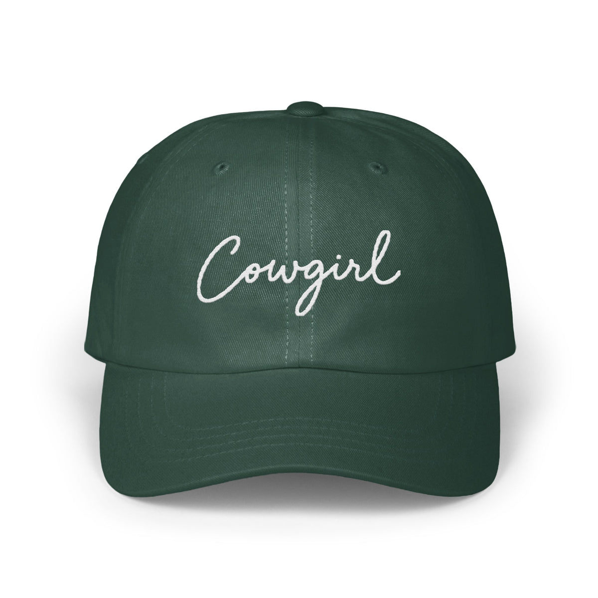 Dark green baseball cap with the word Cowgirl embroidered in white script across the front.