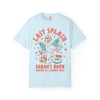 Light blue t-shirt with "Last Splash" flamingo, tropical leaves, and watermelon cocktail graphics.