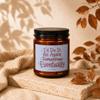 Amber candle with black lid and label reading "I'd Do It All Again Tomorrow Eventually VOWED".