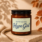 Amber candle with "Official Hype Girl" text on label, vowing.