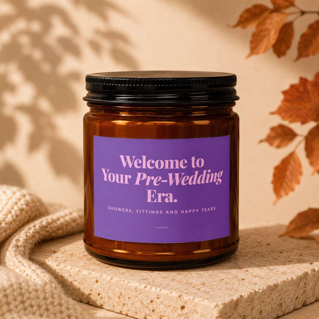 Amber jar candle with purple label reading "Welcome to Your Pre-Wedding Era."