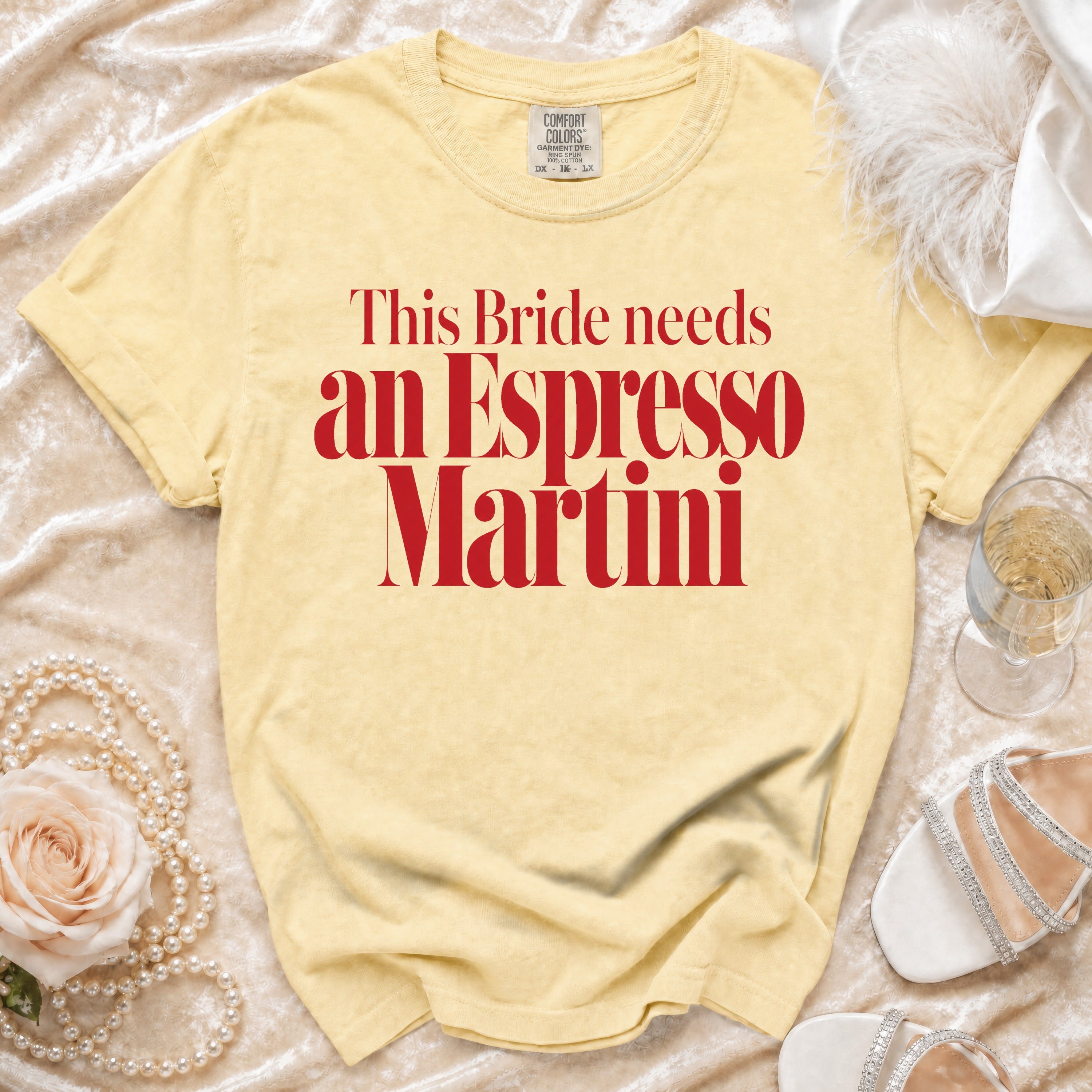 Yellow t-shirt with red text that reads "This Bride needs an Espresso Martini".
