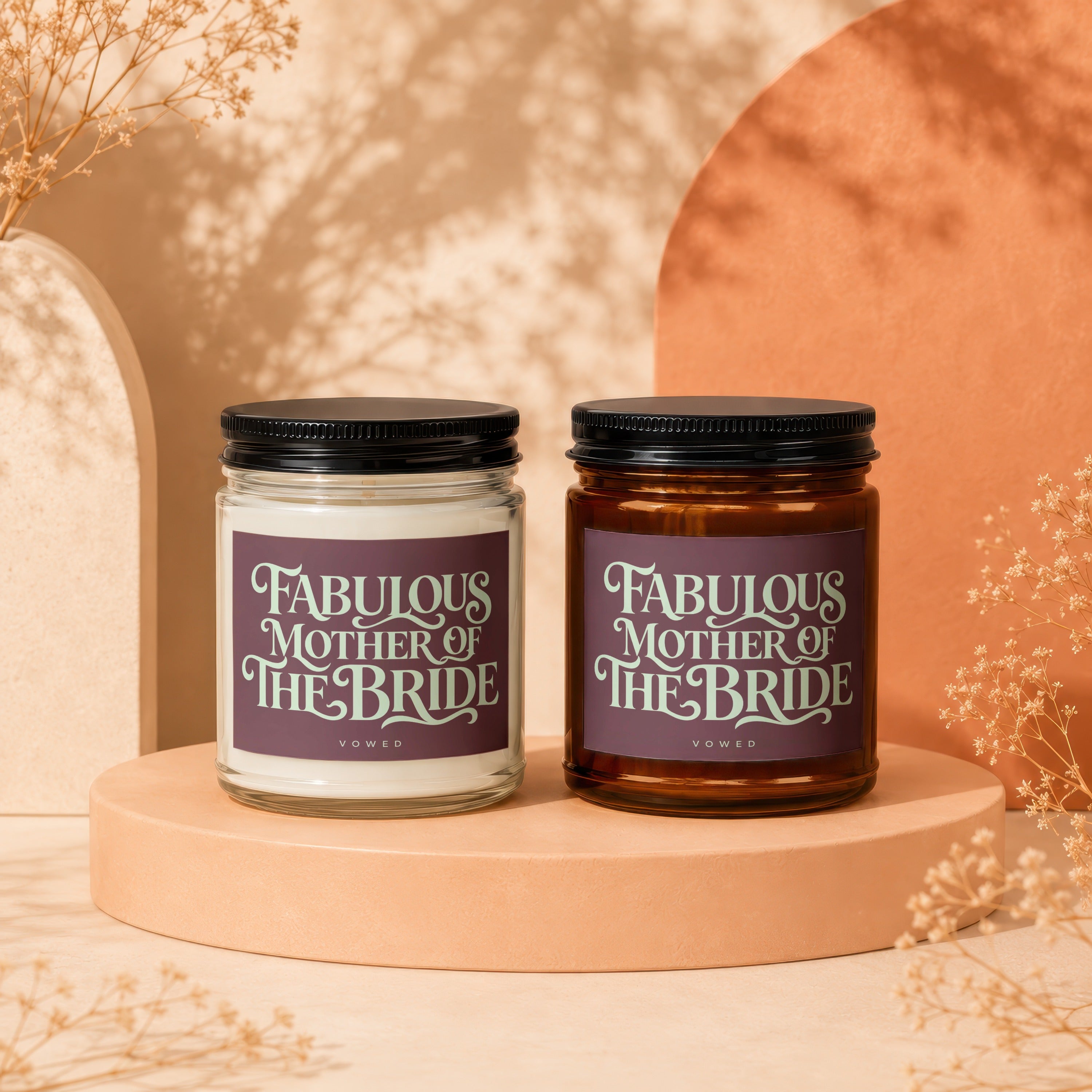 Two lit candles, one clear and one amber, with "Fabulous Mother of the Bride" text.