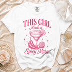 White t-shirt with pink graphic text "This Girl Needs a Spicy Marg" and margarita illustration.