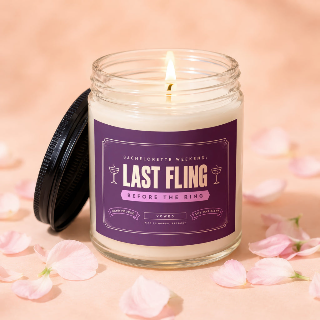 Lit candle with "Last Fling Before the Ring" label, surrounded by pink petals.