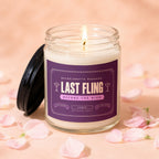 Lit candle with "Last Fling Before the Ring" label, surrounded by pink petals.