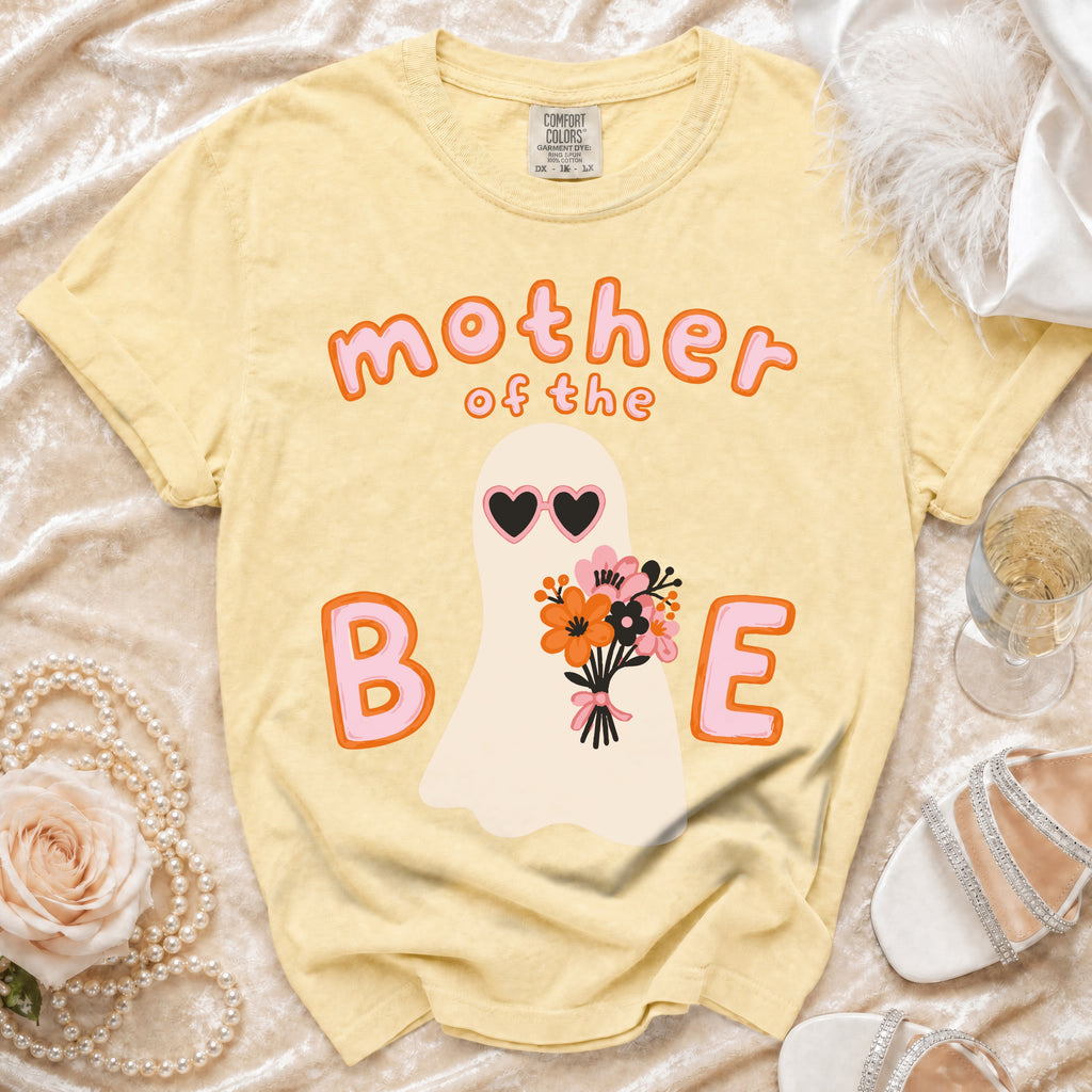 Yellow t-shirt with ghost graphic saying "mother of the B E".