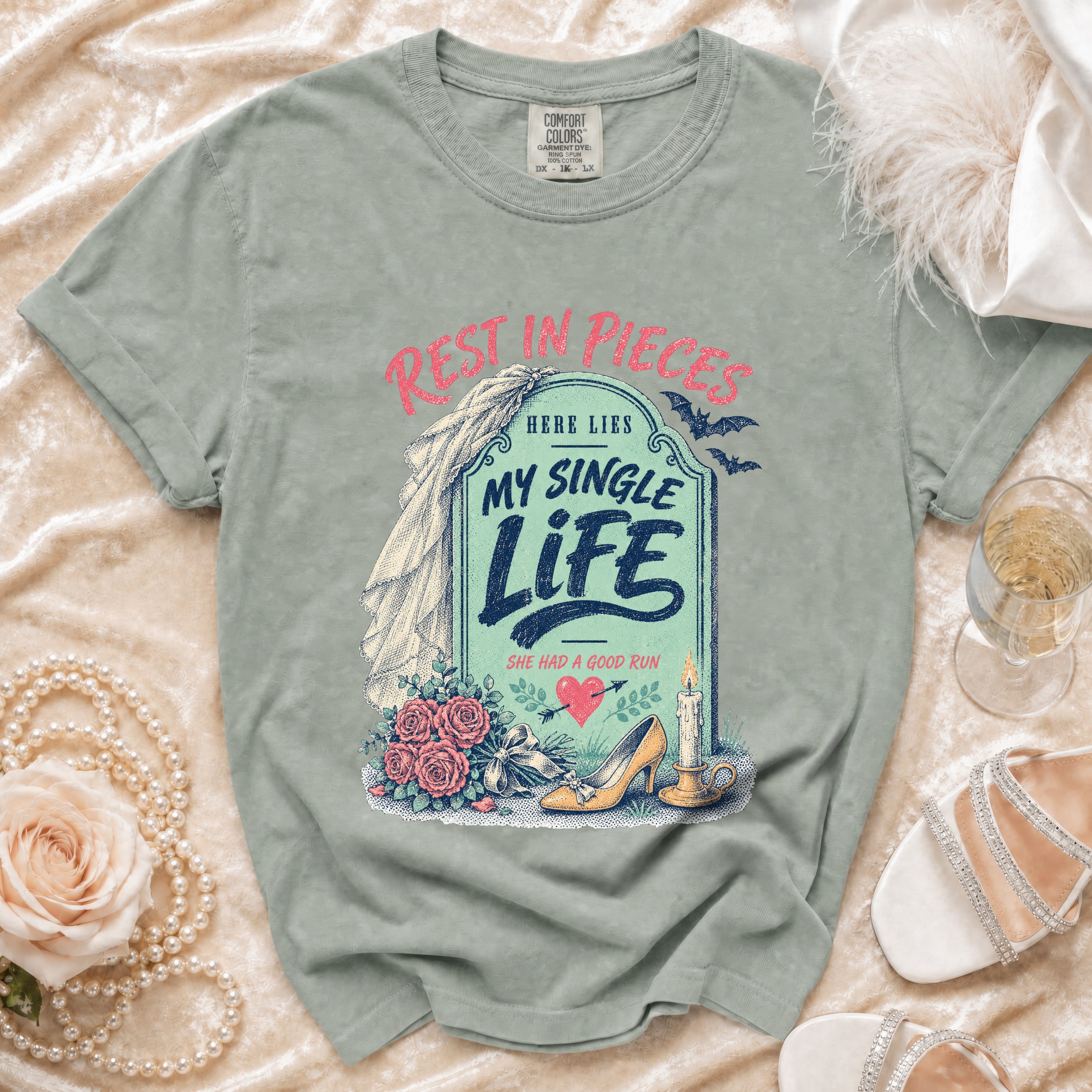 Grey t-shirt with "Rest in Pieces" and "My Single Life" tombstone graphic.