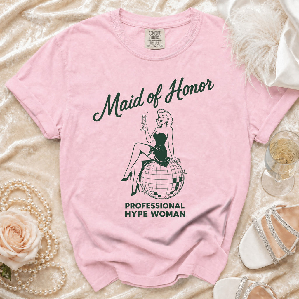 Pink t-shirt with "Maid of Honor" and "Professional Hype Woman" text and graphic.
