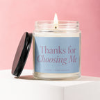 Lit jar candle with black lid, says "Thanks for Choosing Me".