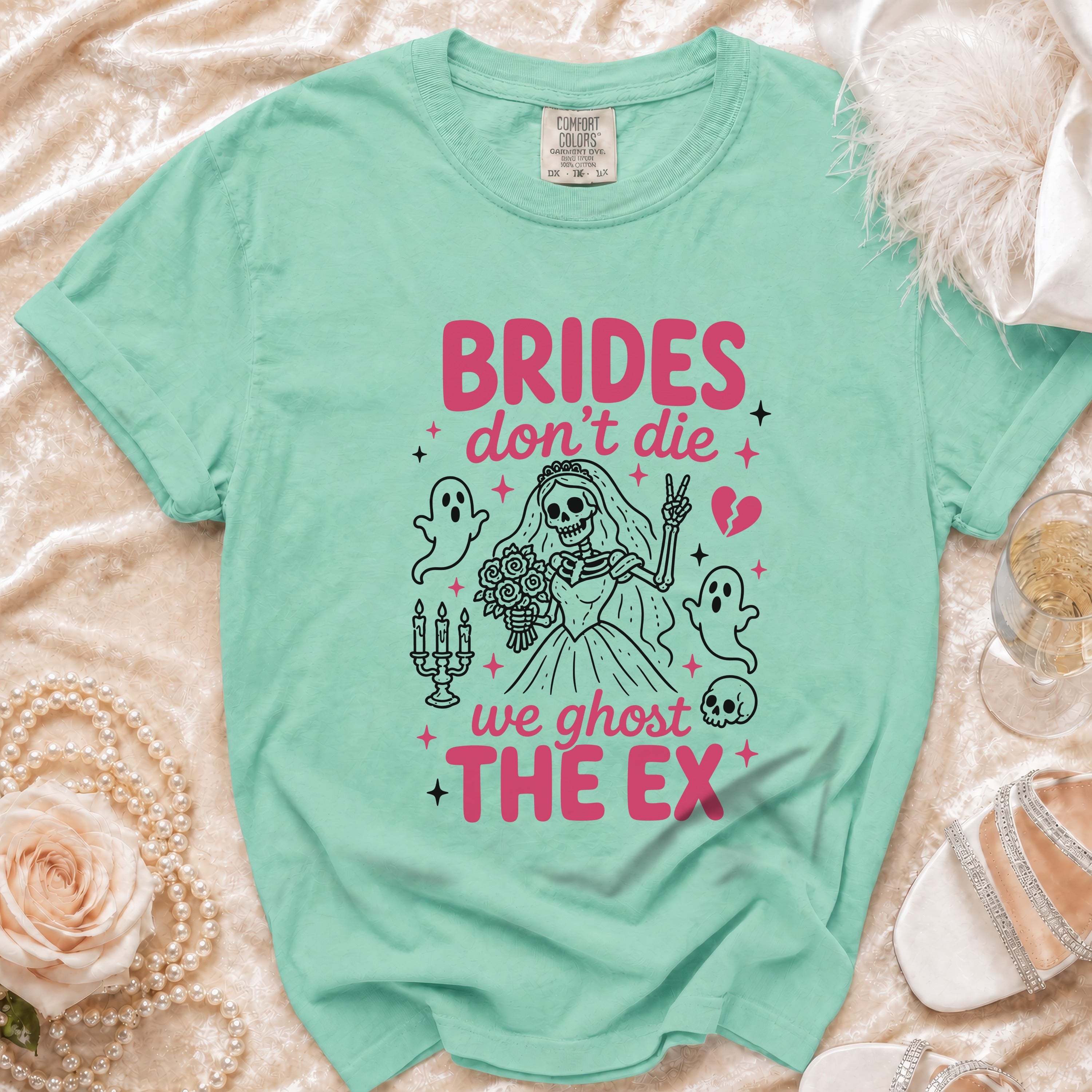 Mint green t-shirt with "BRIDES don't die we ghost THE EX" text and skeleton bride graphic.