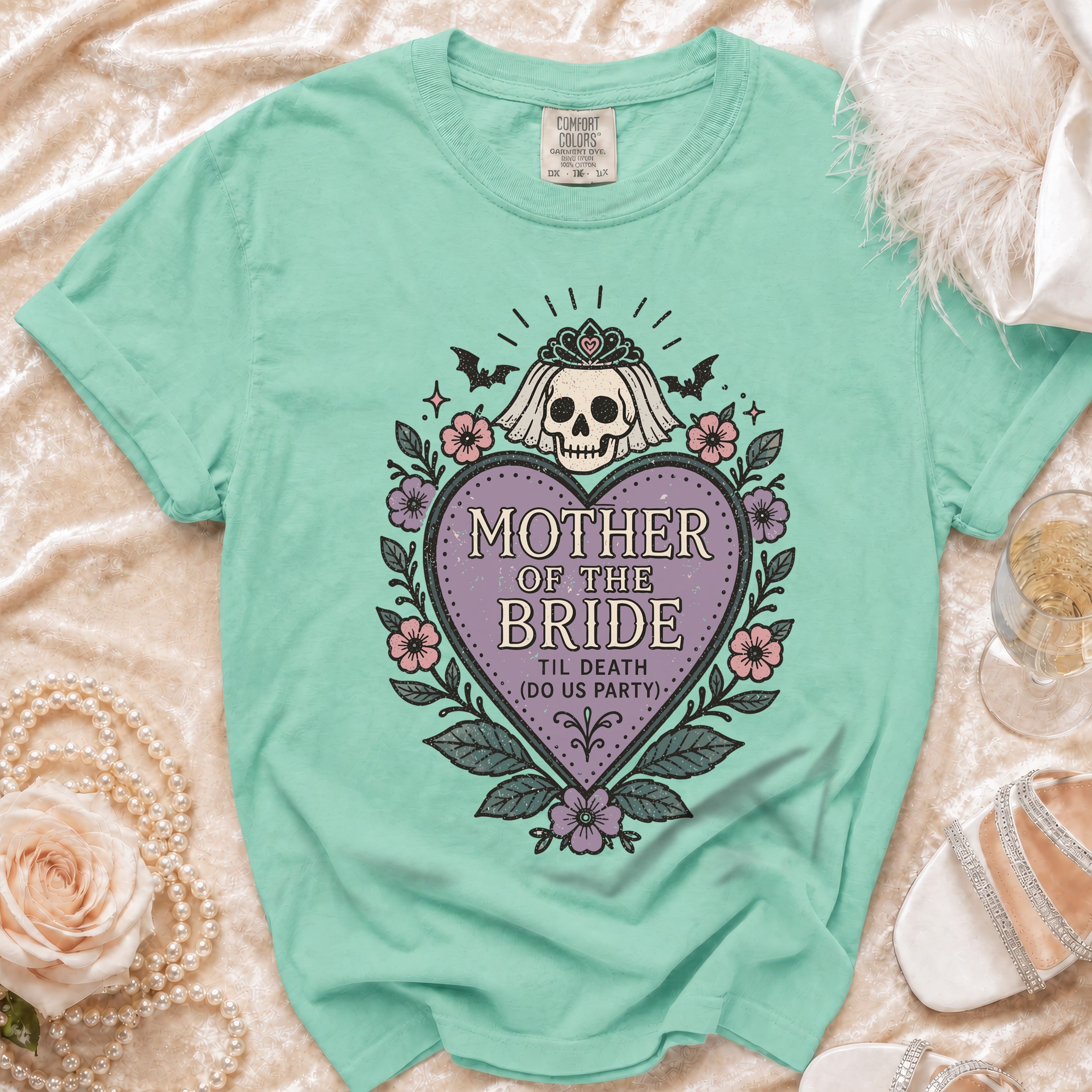 Mint green t-shirt with "Mother of the Bride 'Til Death (Do Us Party)" skull graphic.