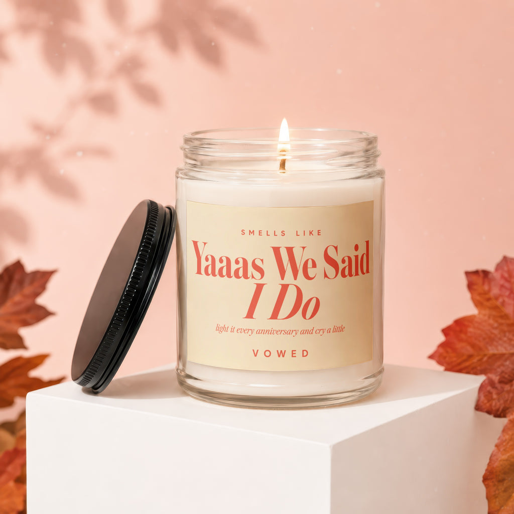Candle with lid off, lit flame, "Yaaas We Said I Do" text.
