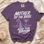 Purple Comfort Colors t-shirt with "Mother of the Bride, Tying the Knot, And the Broom" text and graphics.