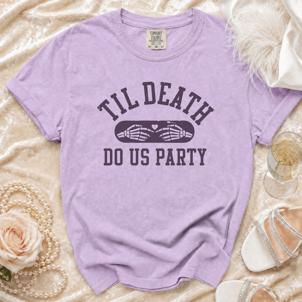 Lavender t-shirt with "Til Death Do Us Party" text and skeleton hands.