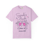 Sarah's Bach Malibu, CA 2026 t-shirt with clinking champagne glasses.
