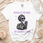 White t-shirt with skeleton graphic and text "Mother of the Bride, My Favorite Title."