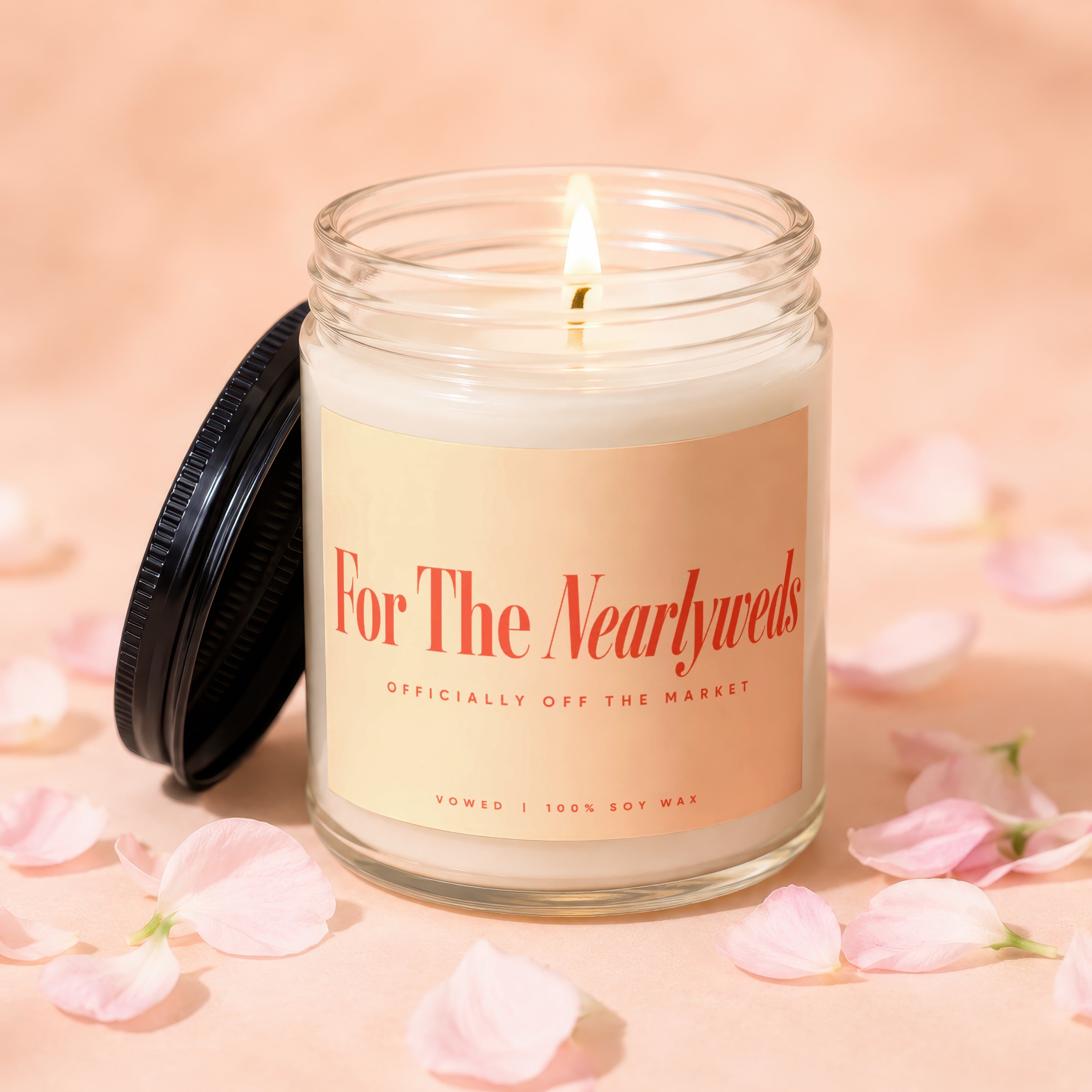 Candle labeled "For The Newlyweds" "Officially Off The Market" "Vowed | 100% Soy Wax".