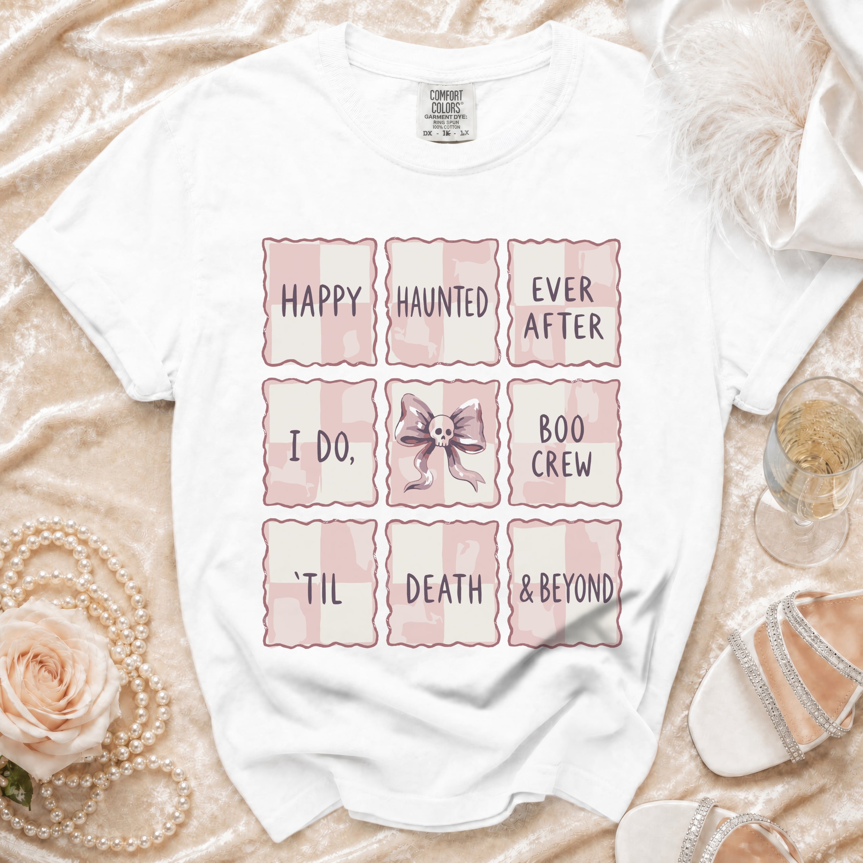 White t-shirt with "Happy Haunted Ever After, I Do, Boo Crew, 'Til Death & Beyond" graphic.