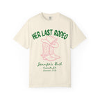 Cream t-shirt with "Her Last Rodeo" text, cowboy boots, and hat.