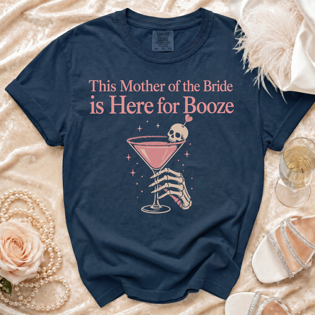 Navy Comfort Colors shirt with "This Mother of the Bride is Here for Booze" text and skull cocktail graphic.