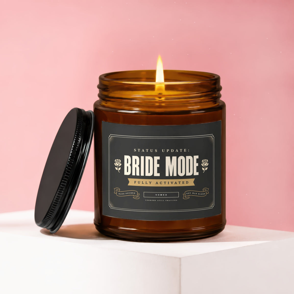 Amber candle with "Bride Mode Fully Activated" label and lit flame.